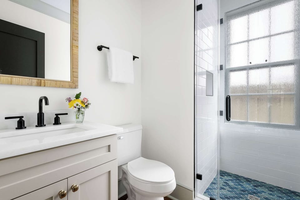 Bathroom 1: Modern bathroom featuring a spacious walk-in shower.