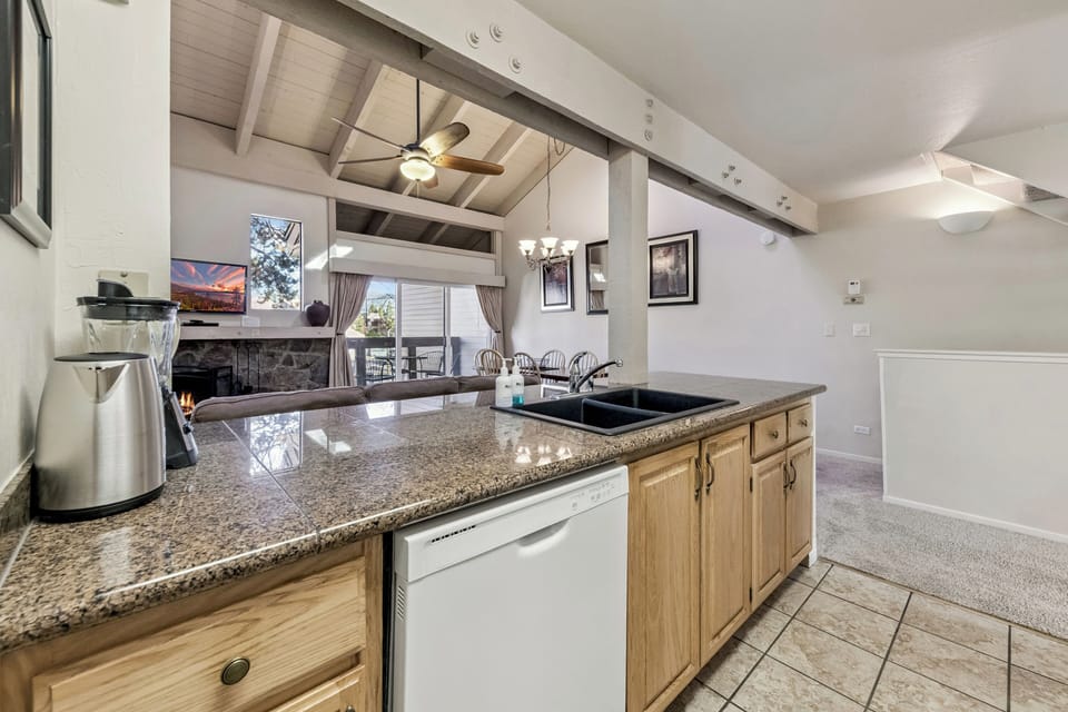 You'll love preparing meals in this spacious kitchen with granite counters, modern appliances, and an open layout perfect for entertaining.
