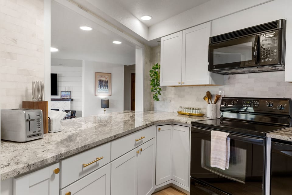 Modern kitchen with everything you need to make a home cooked meal. 