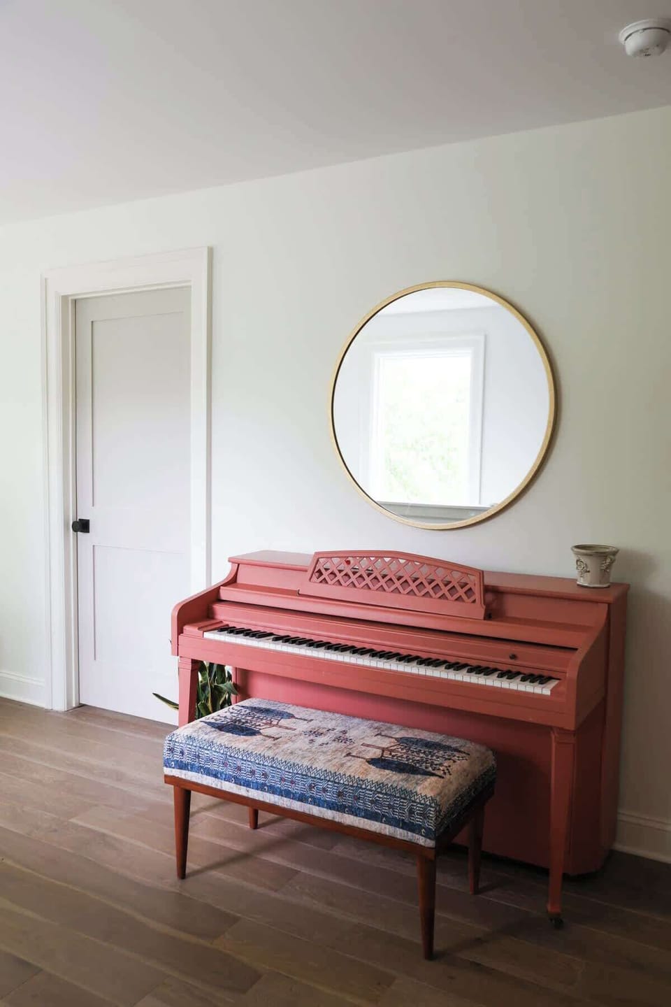 Delight in a vibrant pink piano and charming decor, perfect for creative moments!