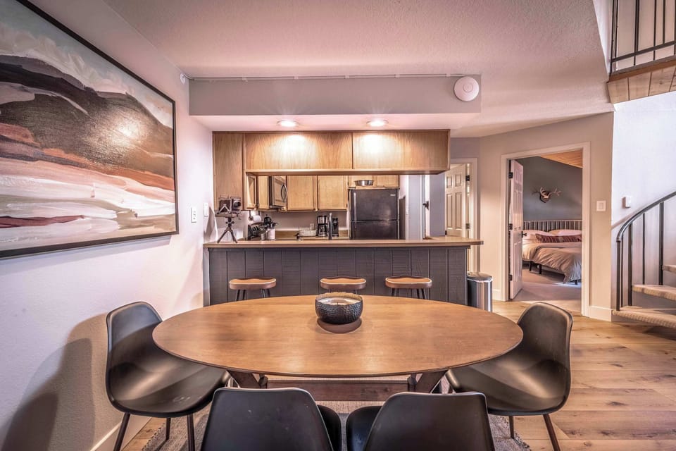 Contemporary dining room with warm lighting.