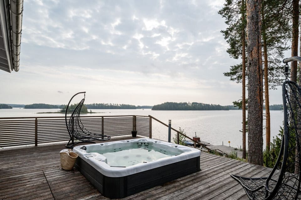 This secluded terrace is the perfect spot to watch the sunset over the water from the comfort of the hot tub.