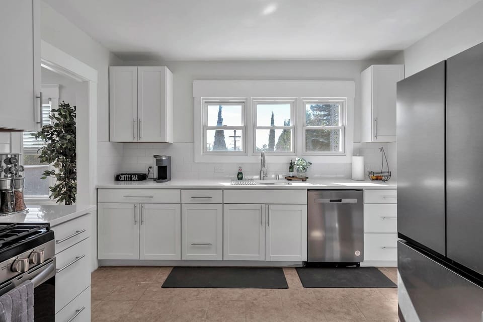 Modern conveniences! Gas stove, dishwasher, refrigerator. Kitchen has Keurig coffee maker, toaster, and blender.
