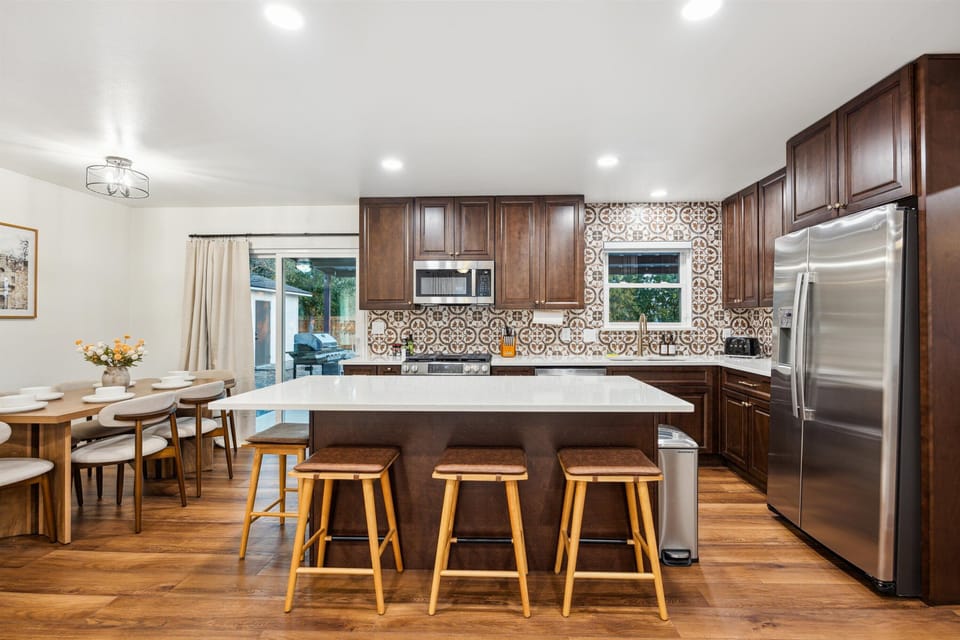Large kitchen island with seating for four—perfect for meals or mingling.
