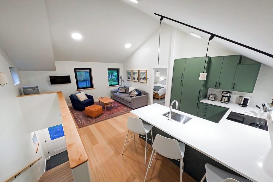 View of the space - living room, kitchen, and breakfast bar