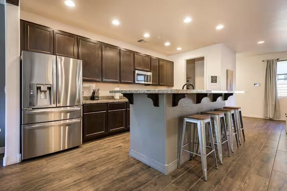 Prepare family meals in the open-concept kitchen with stainless steel appliances