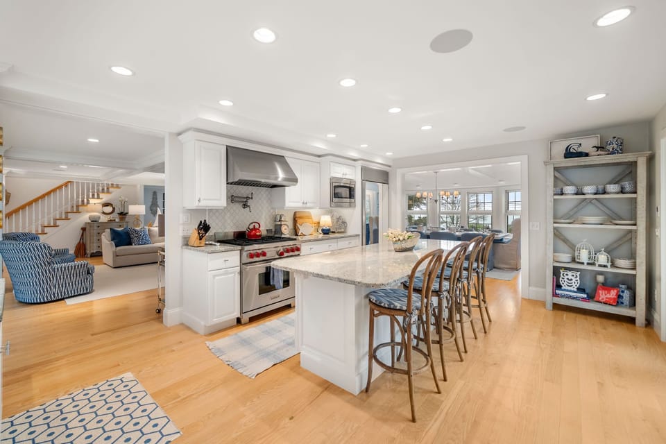 Fully equipped kitchen with modern appliances, dining area & seating for 8