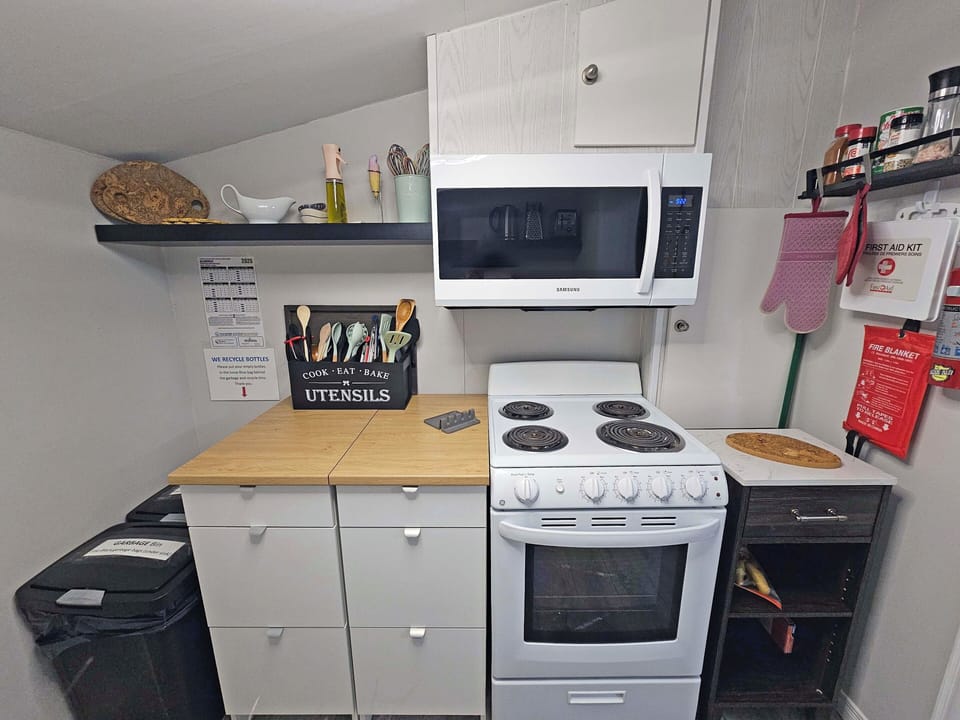 Cooking area with appliances and pantry; fully equipped, typical kitchen. 
