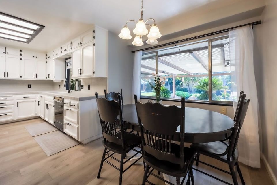 Kitchen and dining room overlooking backyard. 