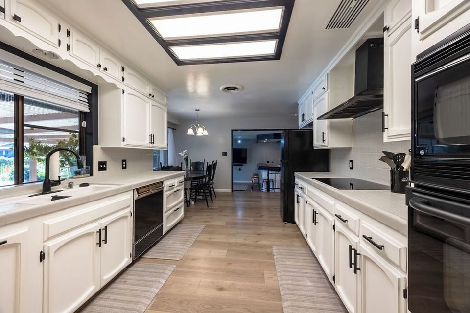 Kitchen leading to the dining and den area.
