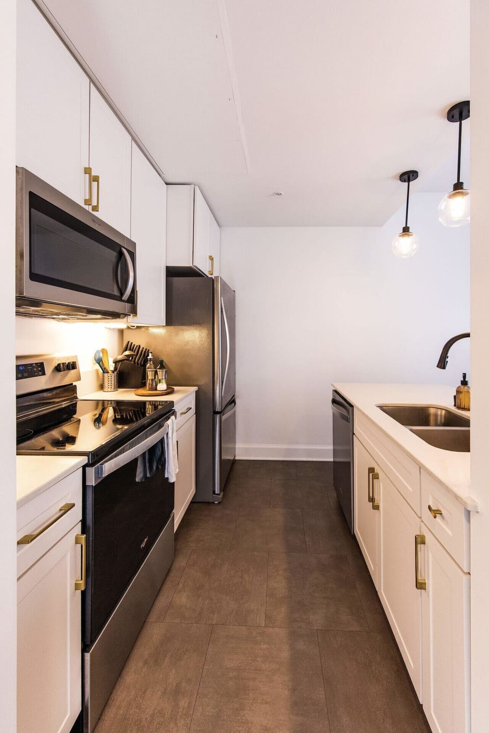 A fully-equipped kitchen featuring high-end finishes and bar seating—everything you need to prep, cook, and refuel