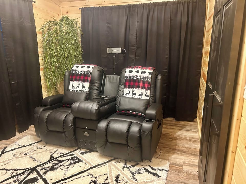 Private home theatre with recliners including heat and message. No bed. 