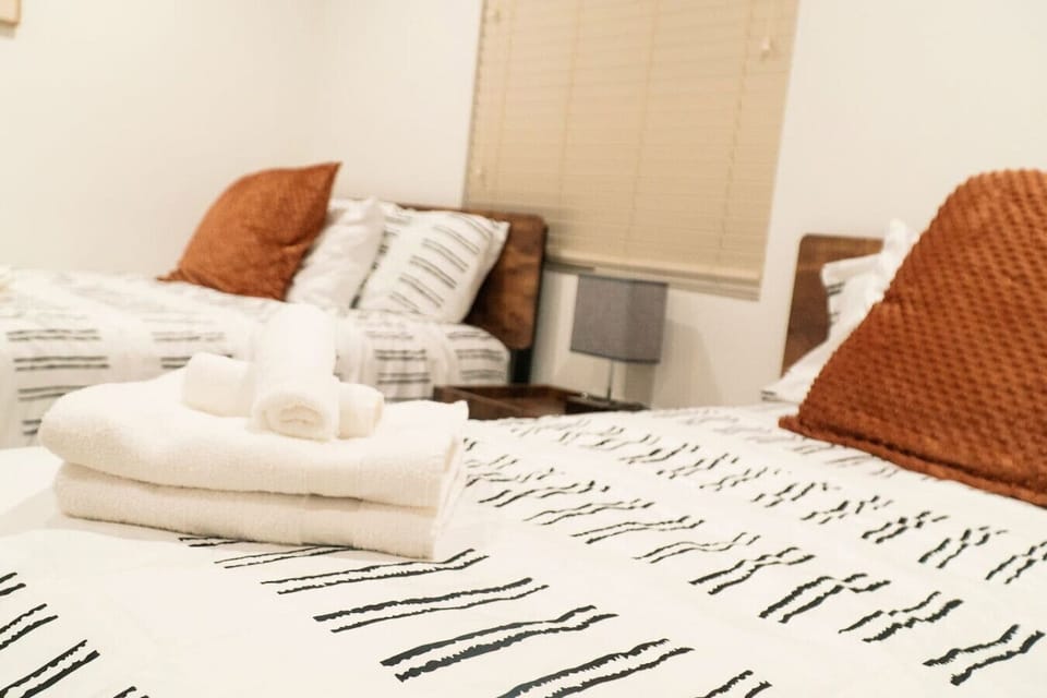 Cozy made bed with towels