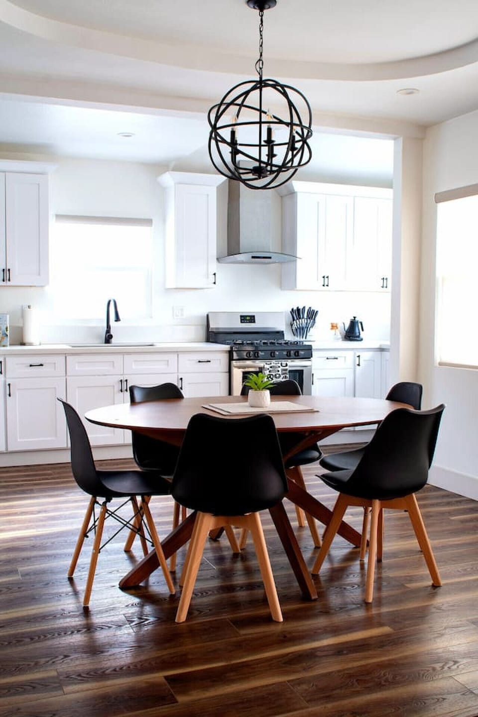 Round dining table with black chairs