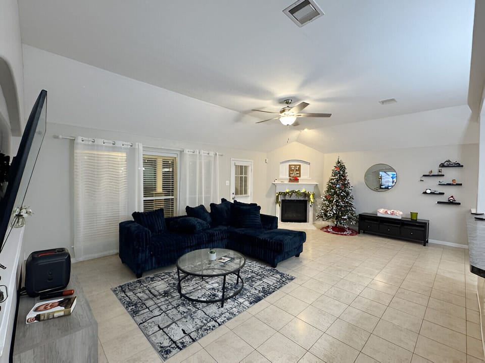 Large, welcoming living room perfect for relaxing, gathering, and making memories.