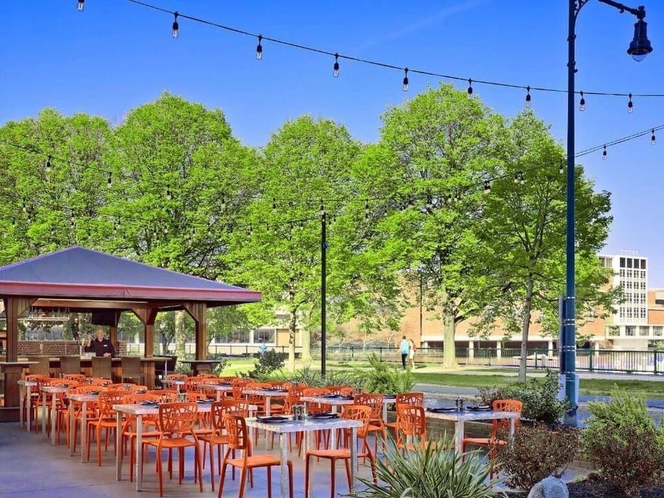 Savor open-air meals beneath café lights and leafy views.