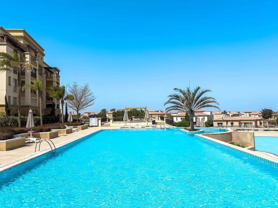 Sit back and relax in the sun on this half Olympic infinity pool. Only steps away from our property. 