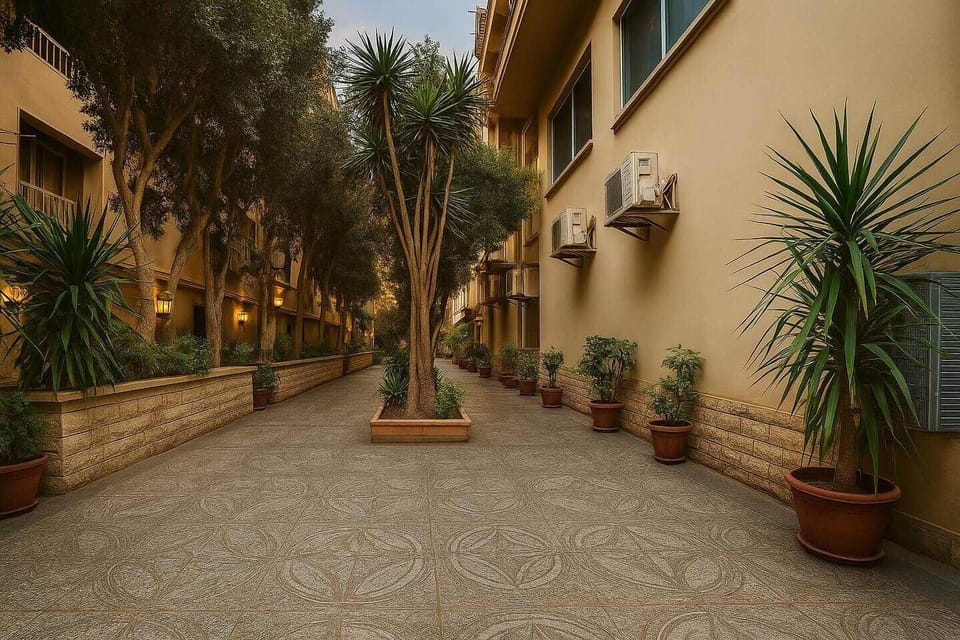 Welcome to your retro-chic home near the ancient  Pyramids of Giza! this lush, tree-lined entrance sets the tone for a peaceful stay in one of Cairo’s most charming neighborhoods. 
