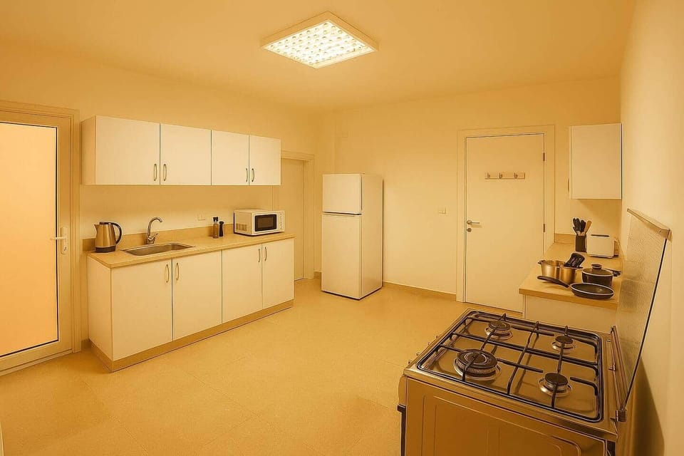 Bright, spotless, and fully equipped—this minimalist kitchen offers everything you need to cook, dine, and feel right at home.
