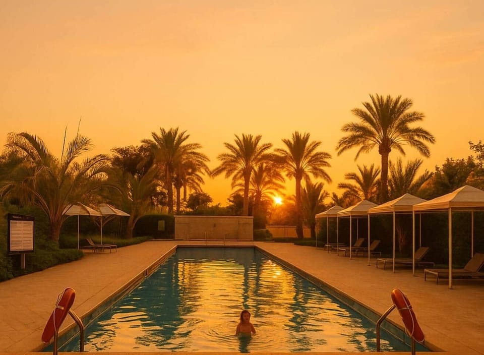Imagine ending your day with a warm sunset glow, surrounded by palm trees and a tranquil pool just steps from your apartment. This is where modern comfort blends with a resort-like atmosphere, giving you the perfect base to experience Cairo in style.
