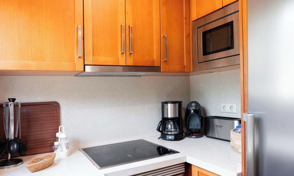 Kitchen is modernly equipped with all installations needed for a comfortable stay. One of few properties with both a washer, stove, microwave, oven, fridge, refrigerator and coffee machine available to all guests. 