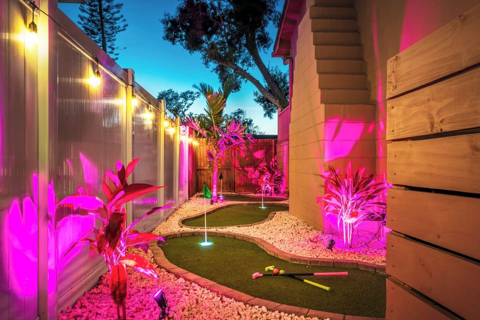 Glow-in-the-dark mini putt for all ages - a playful nighttime favorite