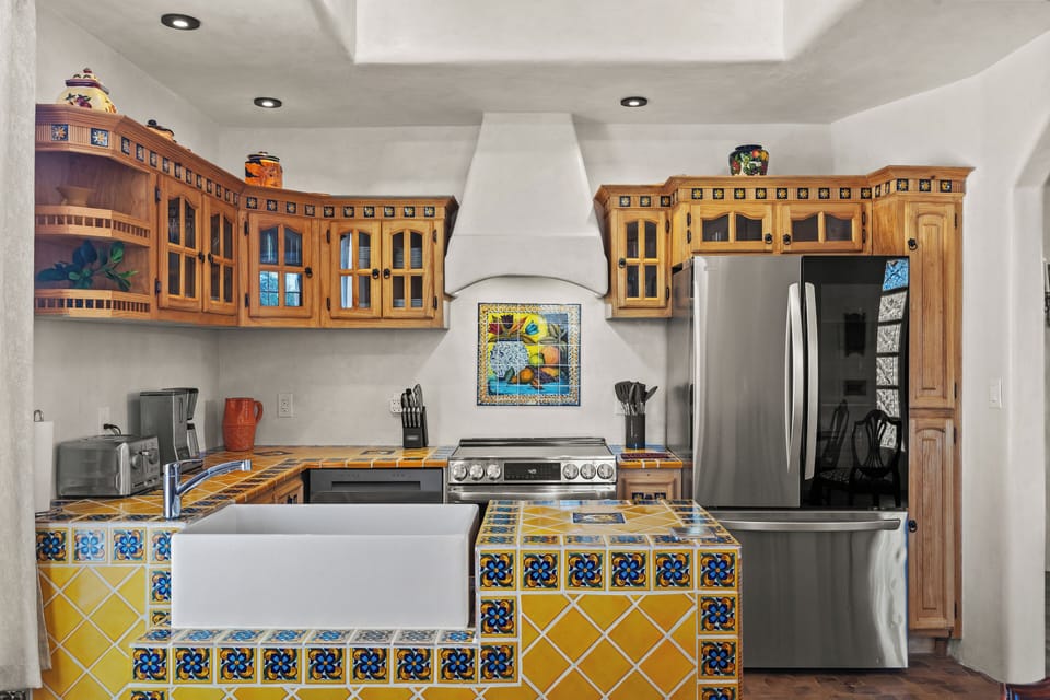 Kitchen with Mexican tile and cabinets