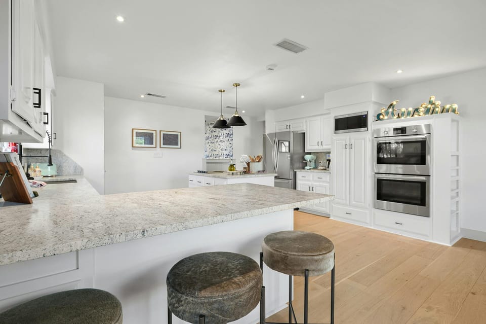 Kitchen – refrigerator, microwave, double wall ovens, induction stove