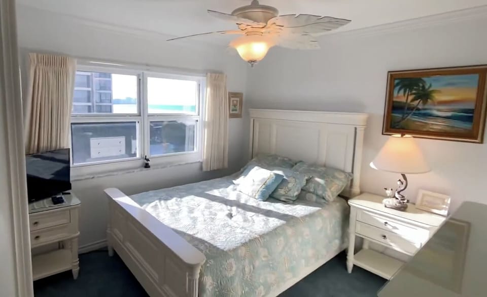 Guest Bedroom with an airy ocean feel and beach views