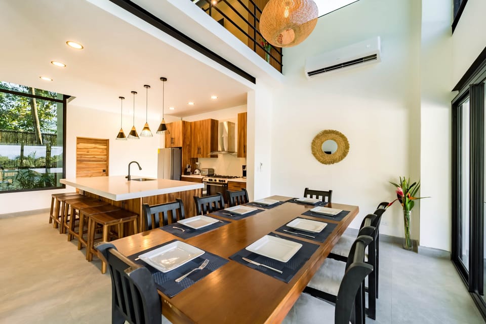 Open dining area connected to the kitchen, ideal for group meals.