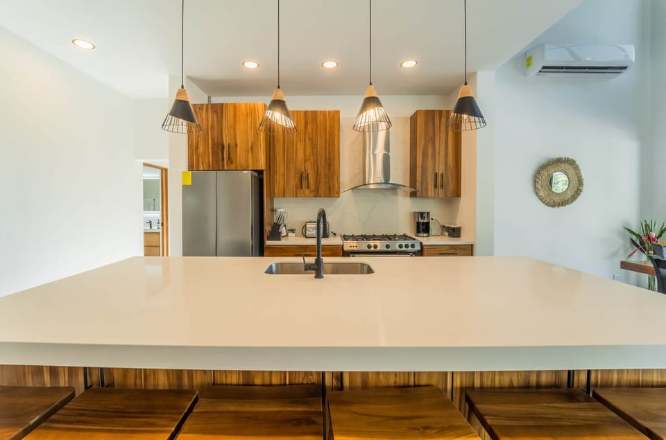 Spacious modern kitchen with oversized island and contemporary finishes.