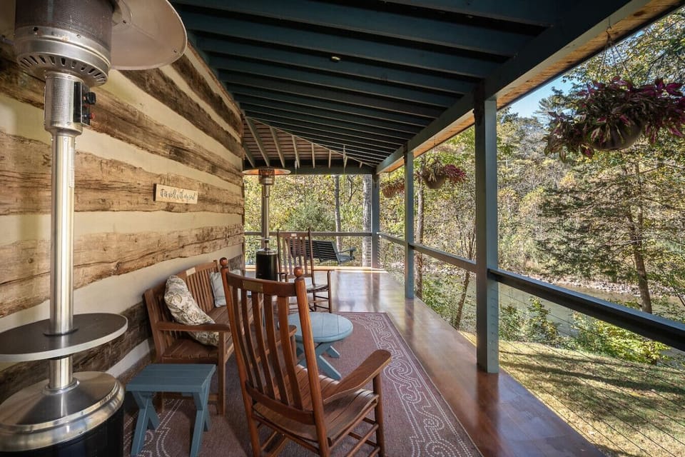 Main Level Side Porch with Chairs – Perfect Spot to Unwind and Enjoy Nature’s Breeze