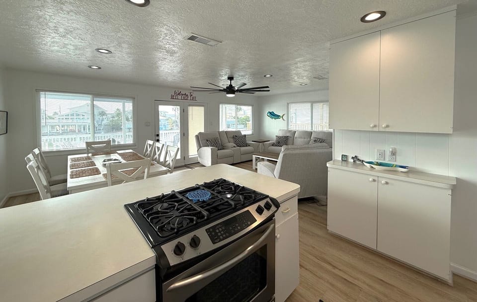 kitchen with open view of dining and living area