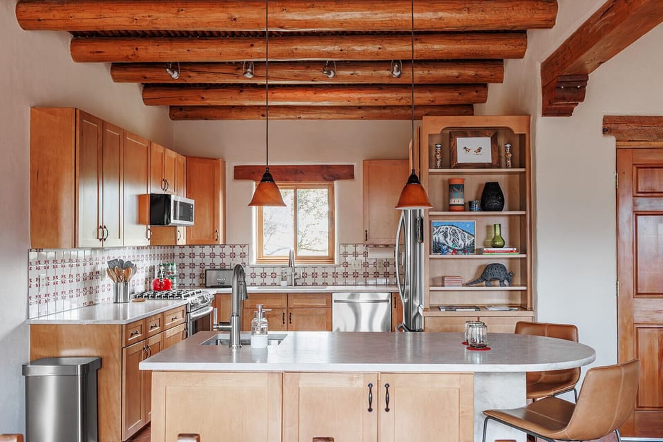 This chef-worthy kitchen offers a stylish space to create, with high-performance appliances and non-toxic cookware for mindful meals.