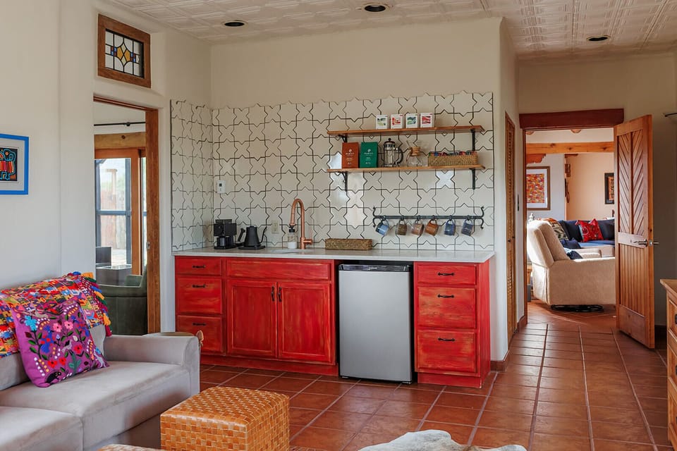 The bright and cheerful kitchenette in the casita opens to the cozy sofa lounge and adjacent to the playroom, making it easy to relax with a warm drink while keeping an eye on little ones at play.