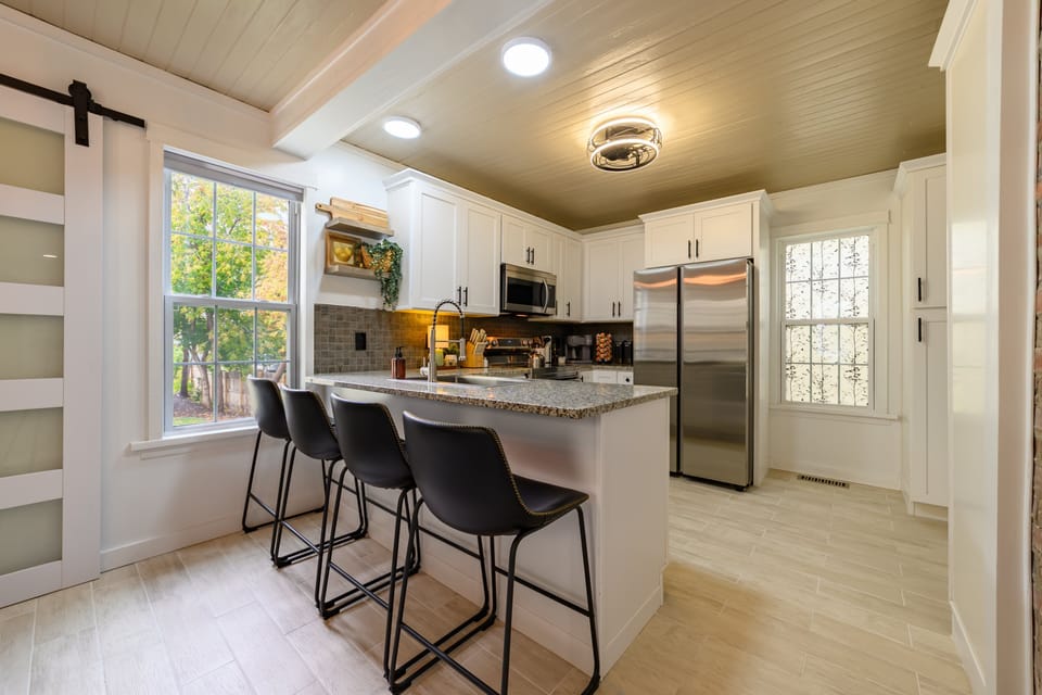 Modern kitchen equipped with cookware, bakeware, small appliances, and all essentials for cooking and entertaining.