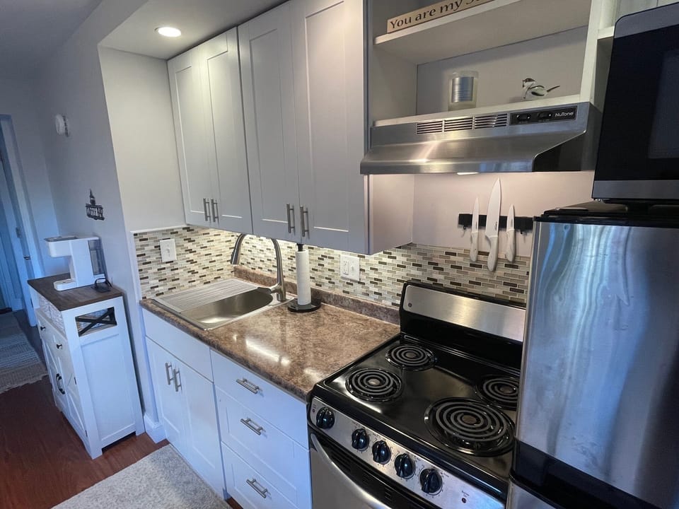 Fully equipped kitchen has everything needed for snacks or full-course meals.