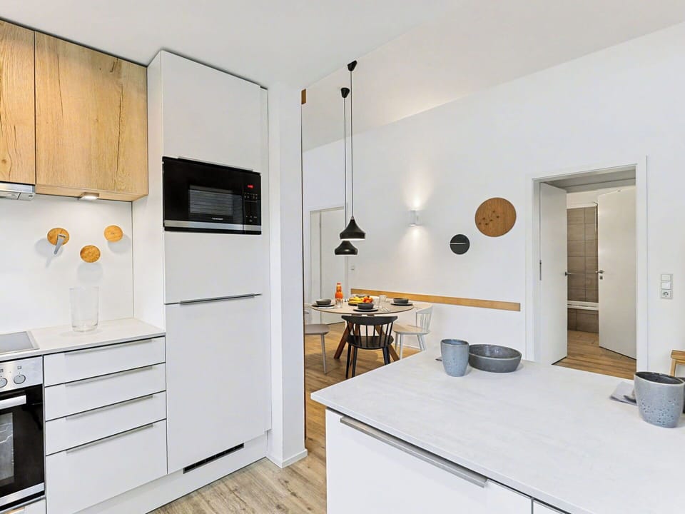 Kitchen, Countertop, Interior Design, Furniture, Flooring, Kitchen Appliance, Wood, Cabinetry, Floor, Light Fixture