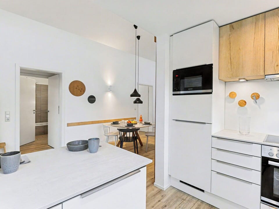 Countertop, Kitchen, Furniture, Interior Design, Flooring, Kitchen Appliance, Wall, Cabinetry, Light Fixture, Wood