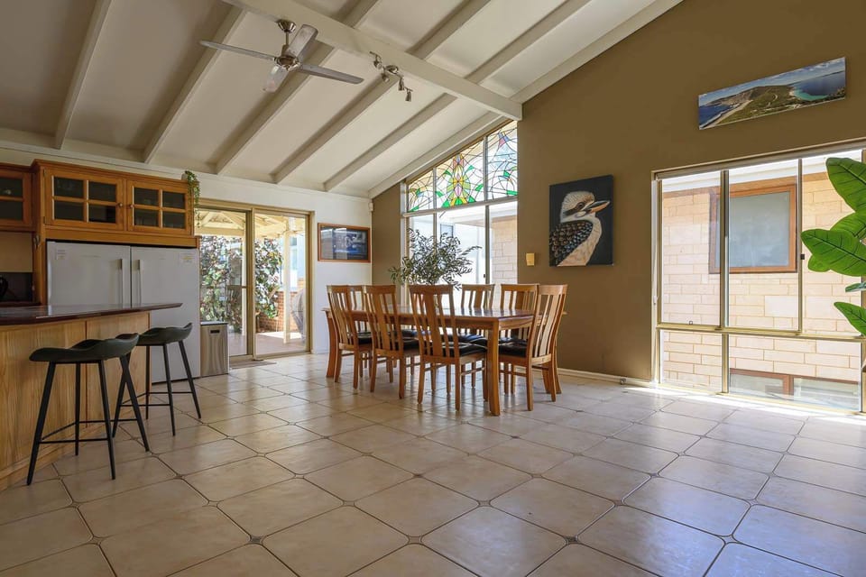 Spacious and sun-filled! ☀️ This gourmet kitchen offers modern appliances and ample storage. The open layout and large windows create a peaceful atmosphere for prepping home-cooked meals.
