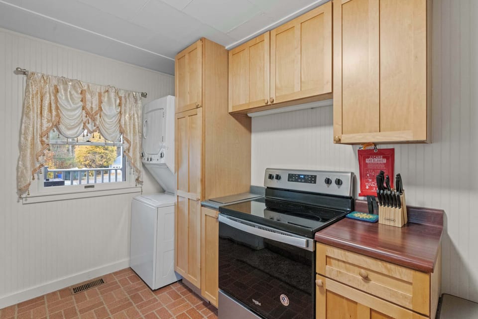 Kitchen includes full stove and oven, coffee maker, and essentials for easy meal prep.