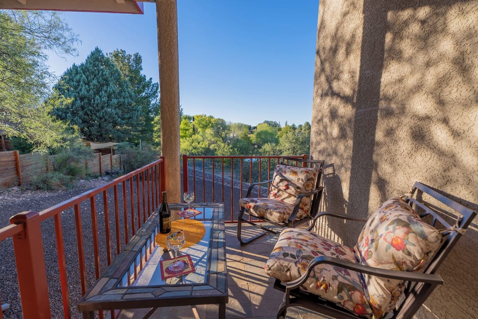 Large back patio features views and privacy, dining and seating areas