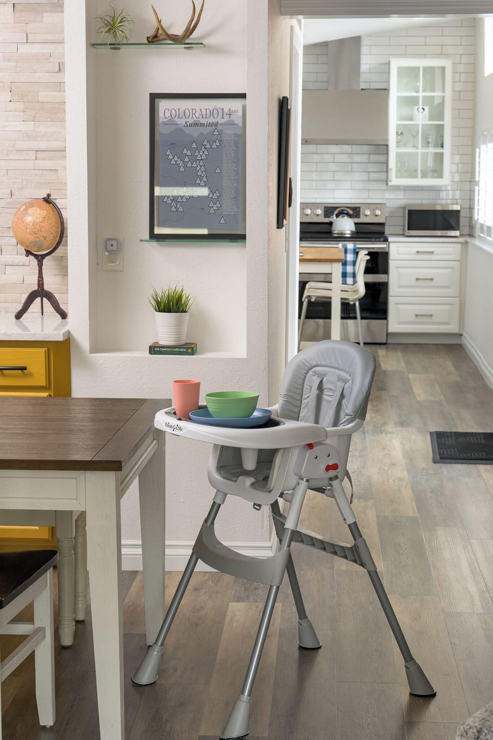 High chair for kids and children dinnerware set available for use.