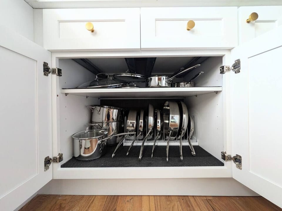 Shiny stainless steel pots and pans.