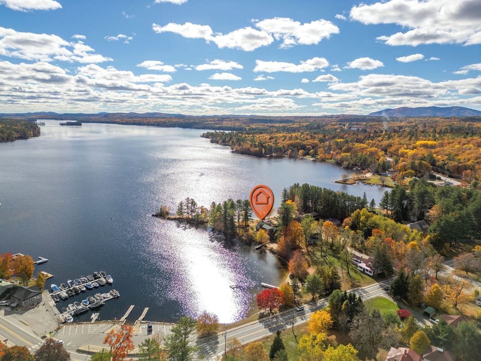 Peaceful lakeside village wrapped in fall colors and weekend escape dreams