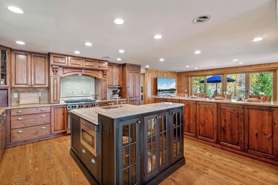 Chef’s kitchen with marble island and elegant modern finishes