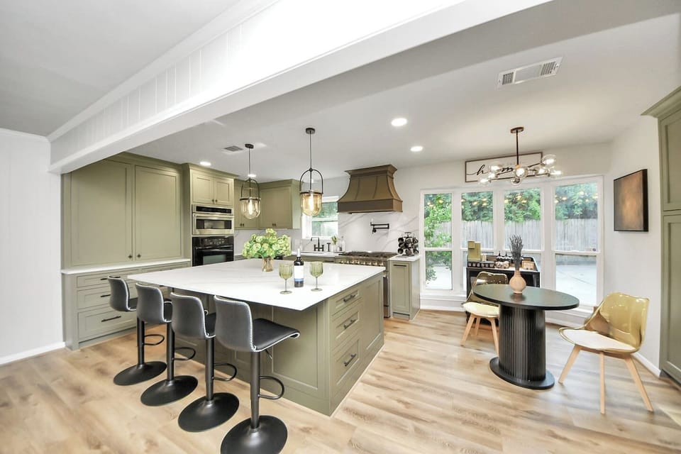 Beautiful island kitchen that just went through a massive remodel! HUGE island with breakfast bar that seats 4 individiuals. New Forno Gas Range, wall over, microwave and dishwasher.