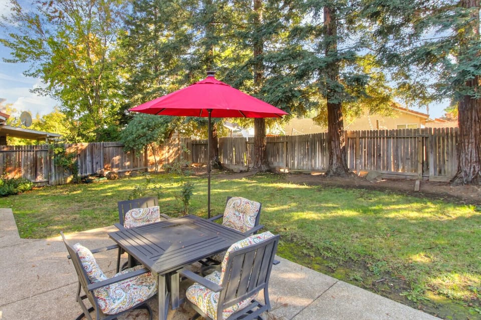Spacious backyard with lounge area.