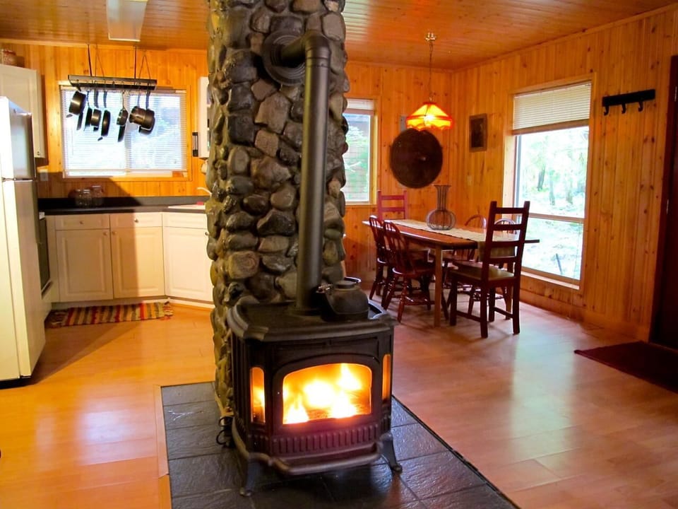 Cozy cabin living room with warm wood stove ambiance