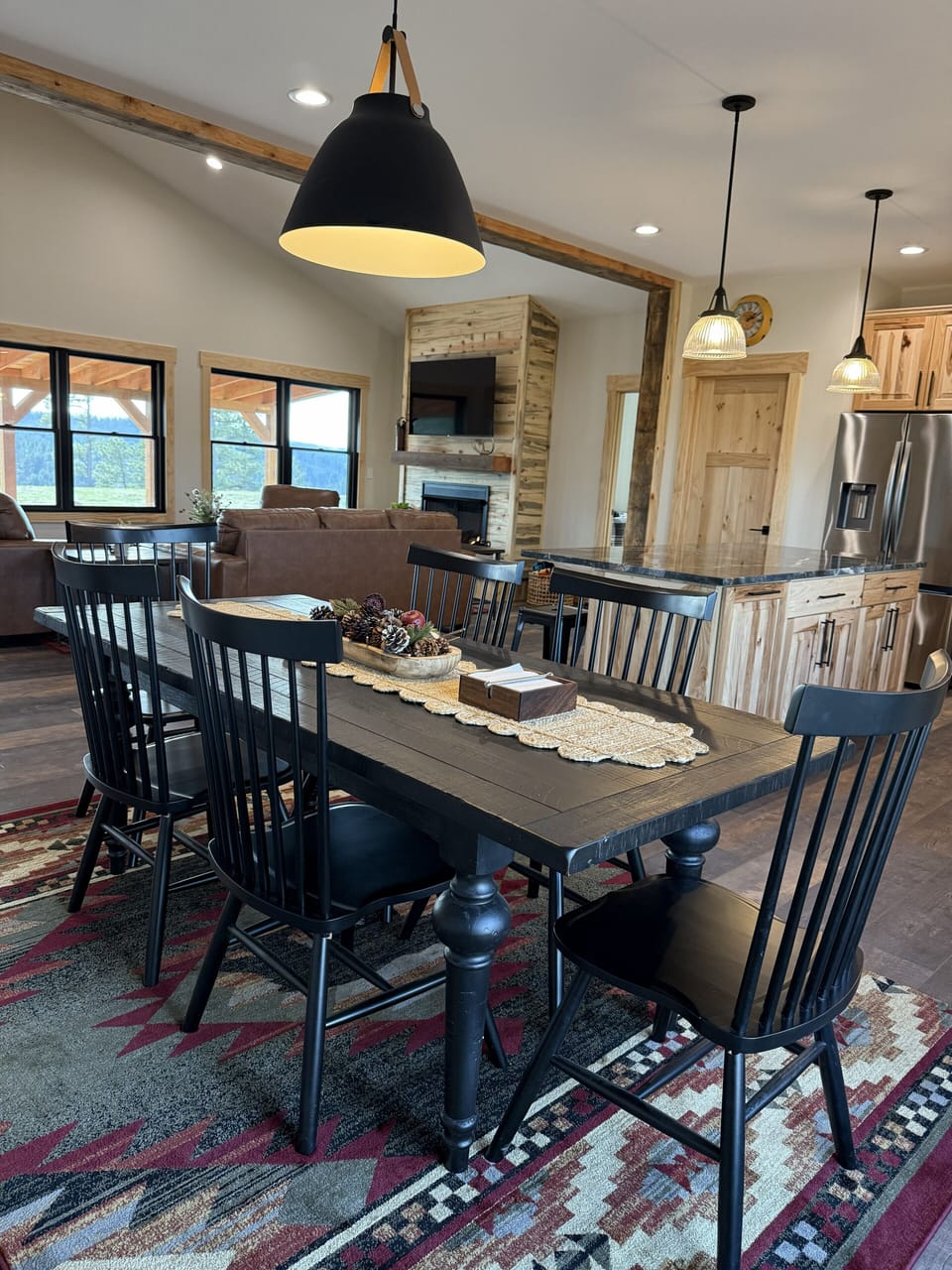 Classic dining area in open floor plan that seats 6 at the table.